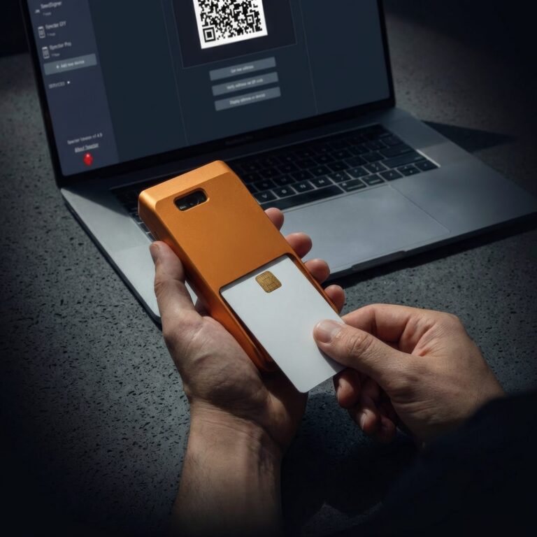 ClavaStack 7 specter shield metal orange specter desktop qr scan hands jpg 768x768